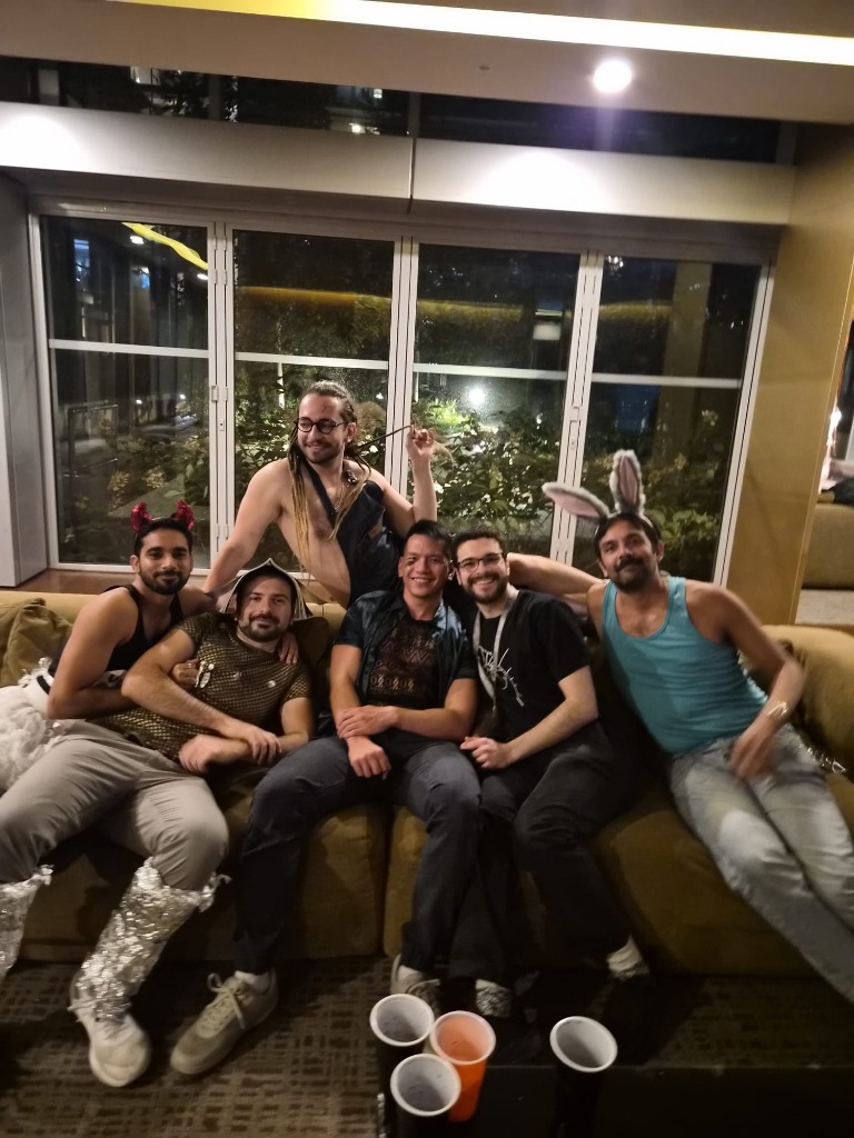Friends relaxing together on the olive couch